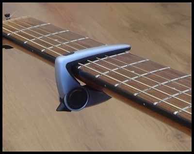 small nickel Hurricane Guitar Capo Round-Up Review - What Is The Best Capo For Acoustic  Guitarists? - Dan Thorpe's Acoustic Guitar Domination