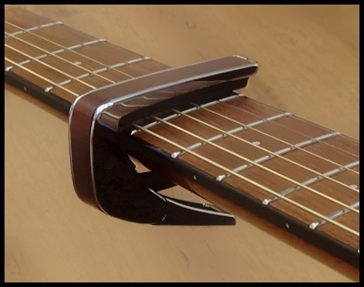 small nickel Hurricane Guitar Capo Round-Up Review - What Is The Best Capo For Acoustic  Guitarists? - Dan Thorpe's Acoustic Guitar Domination